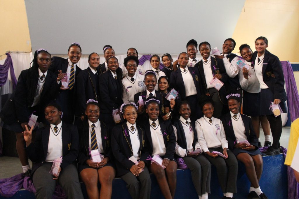 High school learners seated together in uniform